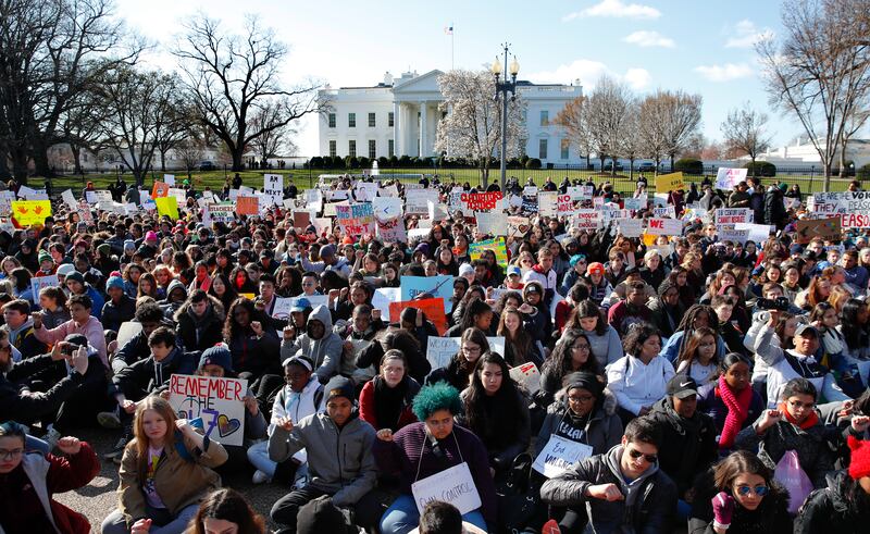 Students rally in front of the White House in Washington, Wednesday, March 14, 2018. Students walked out of school to protest gun violence in the biggest demonstration yet of the student activism that has emerged in response to last month's massacre of 17
