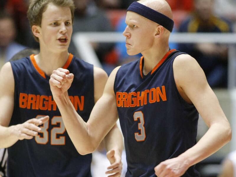 Brighton's Brock Miller pumps his fist as he and teammate John Gremillion celebrate as Brighton and Taylorsville play Tuesday, March 4, 2014 in the Huntsman Center at the University of Utah. Brighton won 65-60.