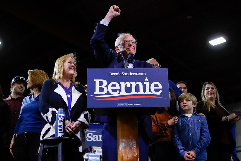 Democratic presidential candidate Sen. Bernie Sanders, I-Vt., accompanied by his wife Jane O’Meara Sanders and other family members speaks during a primary night election rally in Essex Junction, Vt., Tuesday, March 3, 2020.