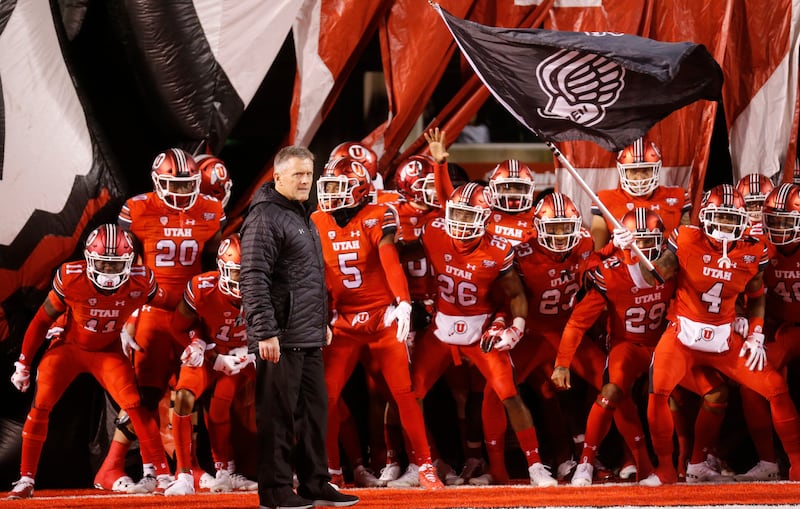 Utah head coach Kyle Whittingham and his team prepares to take the field prior to their game against the BYU during an NCAA college football game Saturday Nov. 24, 2018, in Salt Lake City. (AP Photo/Rick Bowmer)