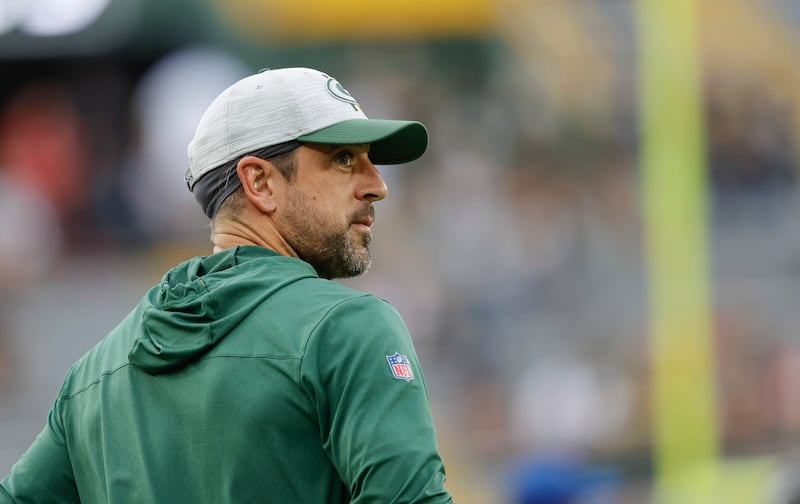 Green Bay Packers quarterback Aaron Rodgers (12) walks on the field before preseason game against the New Orleans Saints Friday, Aug. 19, 2022, in Green Bay, Wis.