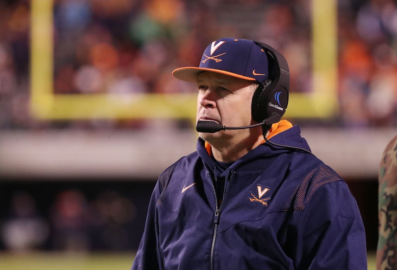 Virginia Cavaliers coach Bronco Mendenhall watches a play during a game with Notre Dame in Charlottesville, Va., on Thursday, Nov. 13, 2021.