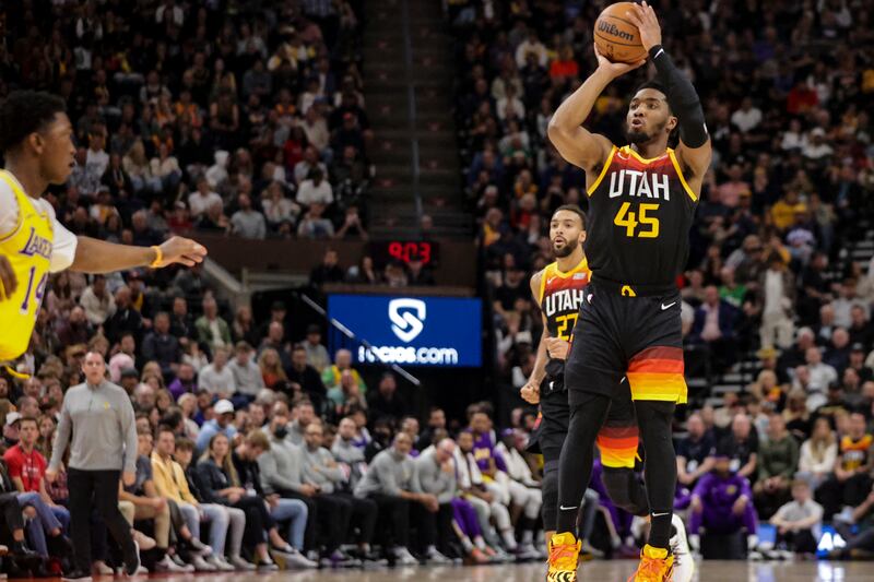 Utah Jazz guard Donovan Mitchell (45) shoots a 3-pointer as the Jazz and the Los Angeles Lakers play.