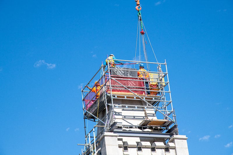 Workers remove stones from the top of the Salt Lake Temple during a major renovation.