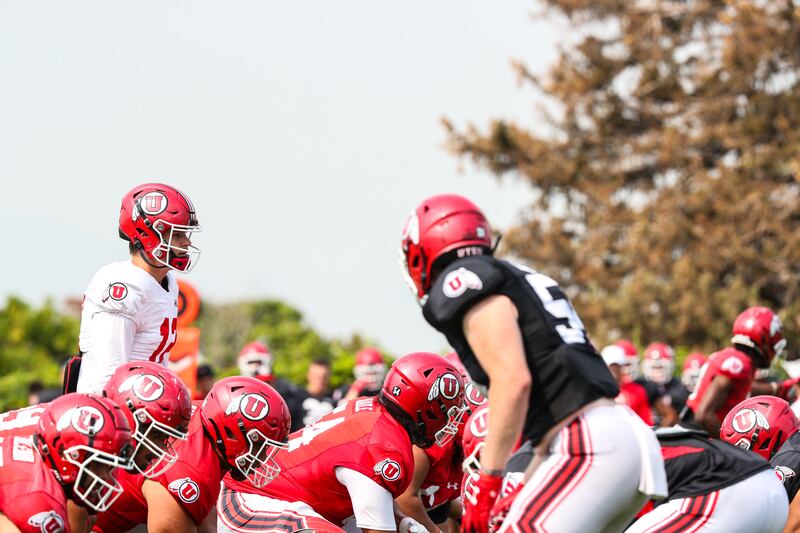 Utah quarterback Charlie Brewer prepares to take a snap during fall camp on Aug. 10, 2021, at the University of Utah.
