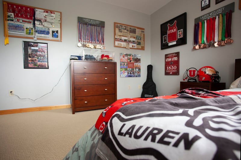 Track and field medals of Lauren McCluskey's along with University of Utah memorabilia hang on her bedroom wall on Friday, May 24, 2019, at the McCluskey home in Pullman, Wash. Lauren McCluskey was murdered in October of 2018 on the University of Utah cam