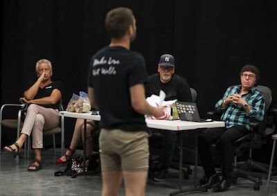 Air Supply’s Graham Russell, left, Craig Clyde and Sam Goldstein, a neurologist at the University of Utah, listen to actor John Patrick McKenna sing during rehearsal for the musical “A Wall Apart” at the TV studio on the Salt Lake Community College campu