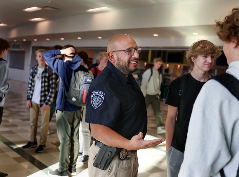 Unified Police SRO Detective Jaime Cardenas speaks with students at Olympus High School in Holladay.