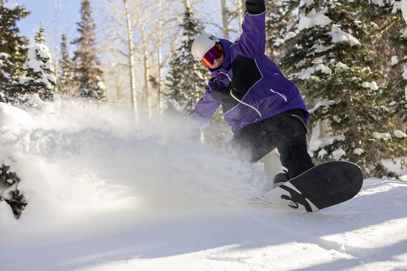 Ashton Mateny, of Orem, finds fresh snow in the trees at Brighton Resort in Big Cottonwood Canyon on Monday, Nov. 14, 2022.