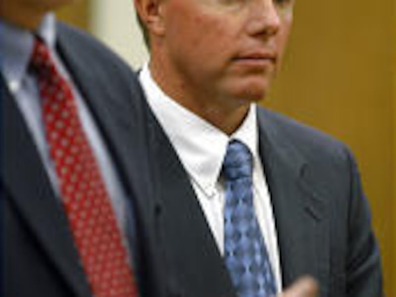 Rodney Holm, right, listens as attorney Rodney Parker, left, asks Thursday for termination of supervised probation.