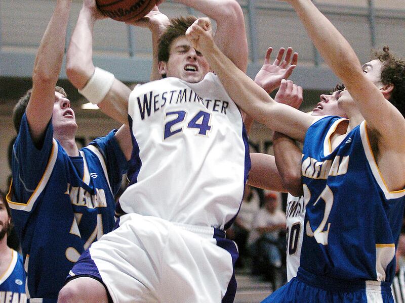 Les Brown of Westminster comes down in a mass of defense with an offensive rebound in Westminster Basketball action against Lakehead College (Ontario, Canada) in Salt Lake. November 4, 2006. Mike Terry, Deseret Morning News.