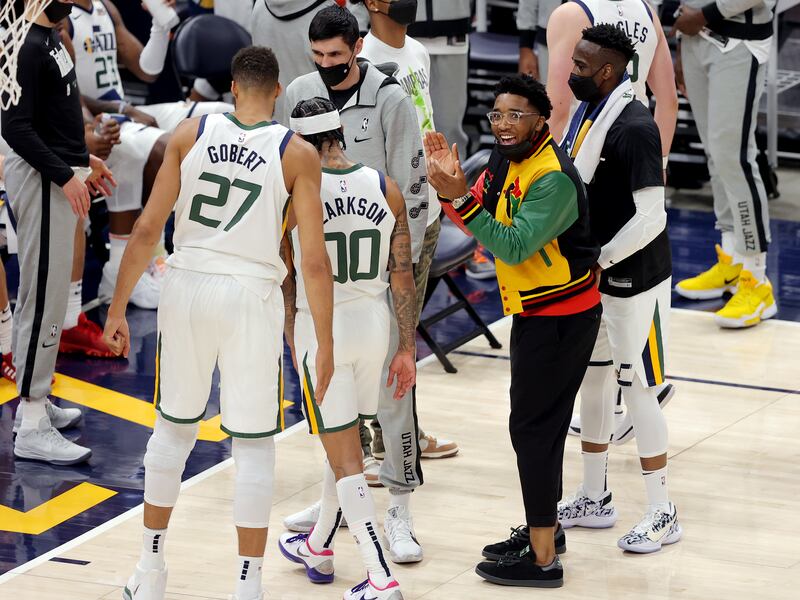 Utah Jazz guard Donovan Mitchell claps during a timeout as the Jazz and the Memphis Grizzlies play Sunday, May 23, 2021.