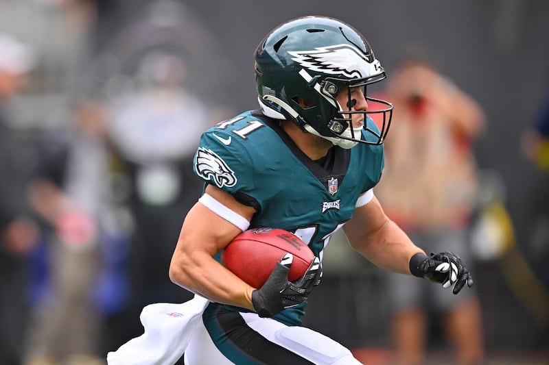 Philadelphia Eagles wide receiver Britain Covey (41) runs with the ball looks to pass during an NFL preseason football game against the Cleveland Browns, Sunday, Aug. 21, 2022. The Eagles won 21-20.
