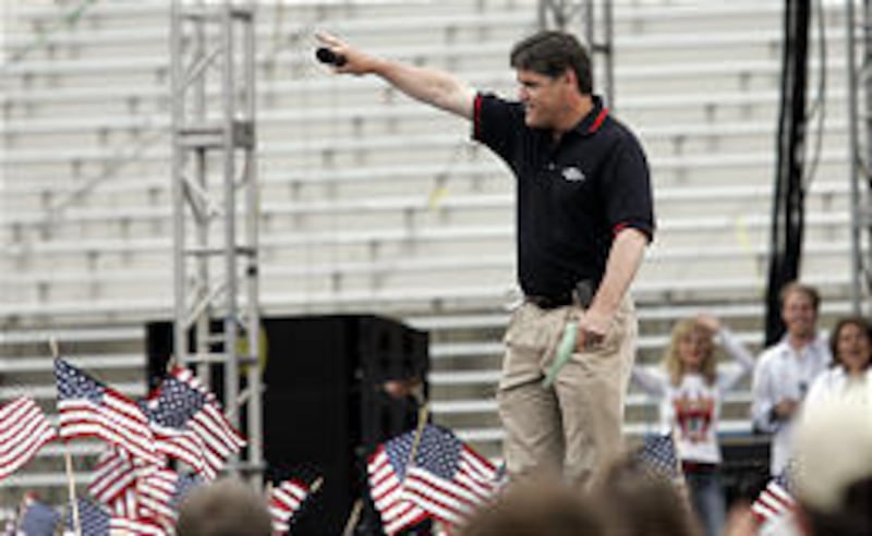 Talk show host Sean Hannity greets the crowd at Stadium of Fire. Some Hannity fans missed his comments due to a speaker problem.