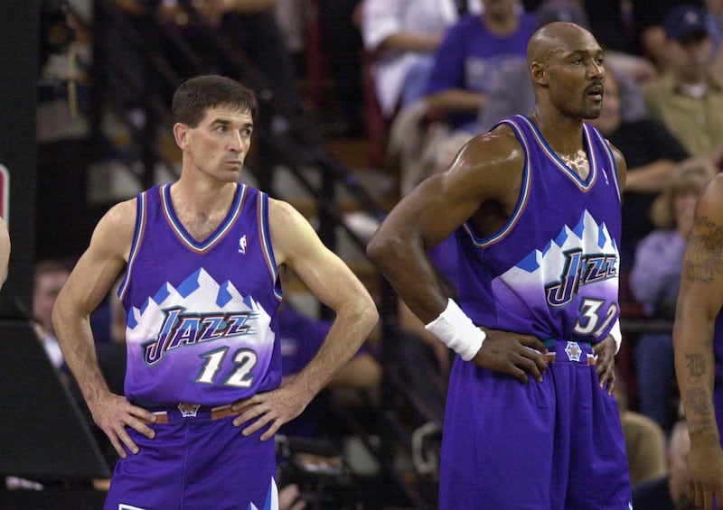 Utah Jazz’s John Stockton, left, and Karl Malone watch as the Sacramento Kings walk onto the court following a time-out during the third quarter of Game 5 of the Western Conference first-round playoff series, Wednesday, April 30, 2003, in Sacramento, Calif. The Kings won 111-91, winning the series 4-1. (AP Photo/Rich Pedroncelli) (Submission date: 05/01/2003)