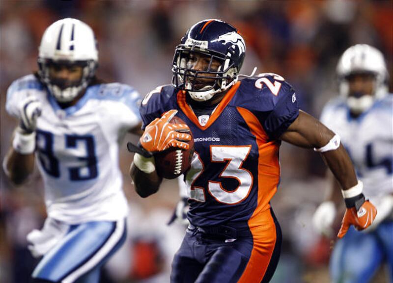 Denver Broncos running back Andre Hall runs for a touchdown Monday past Tennessee Titans defensive back Michael Griffin.