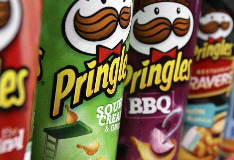 Diamond Foods Inc. is buying Procter & Gamble Co.’s Pringles chips business in a $1.5 billion deal, the biggest in a string that have given the maker of