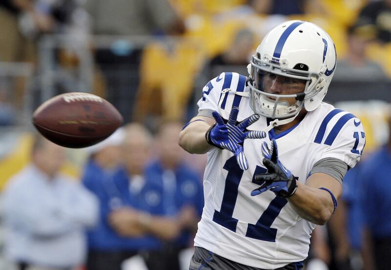 In this Aug. 19, 2012, photo, Indianapolis Colts wide receiver Austin Collie warms up before an NFL preseason football game against the Pittsburgh Steelers in Pittsburgh.