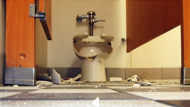 A toilet inside the Carl's Jr. in Centerville is in pieces after a man accidentally dropped his concealed weapon. A bullet struck the toilet, and the flying shrapnel wounded the man.