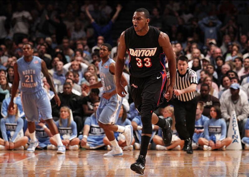 NIT champion Dayton's Chris Wright, who had 14 points, celebrates after making a basket in the NIT title game.