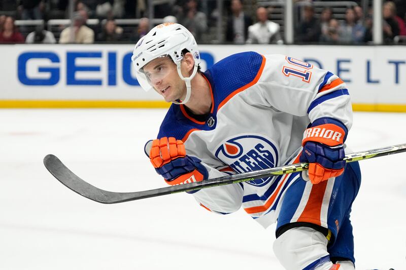 Edmonton Oilers center Derek Ryan celebrates after scoring the game-winner in a shootout of an NHL hockey game against the Los Angeles Kings.