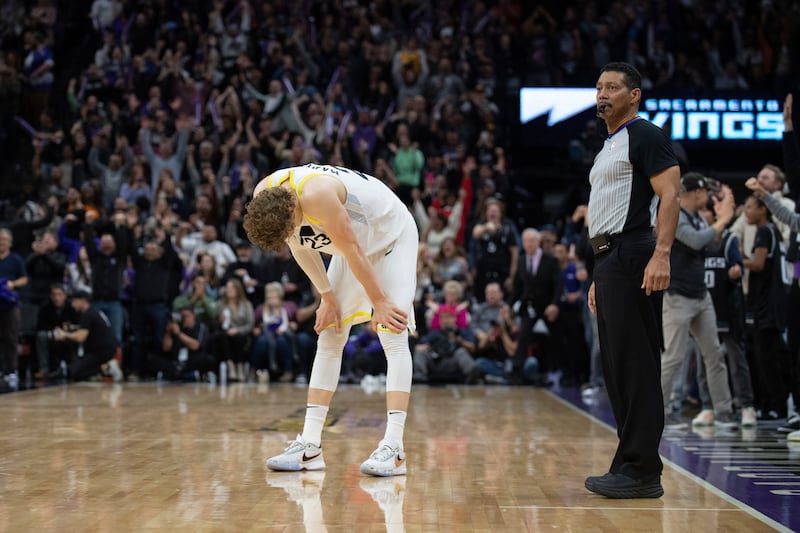 Utah Jazz forward Lauri Markkanen stands next to referee Bill Kennedy after missing a shot in the closing seconds of the team’s NBA basketball game against the Sacramento Kings in Sacramento, Calif., Friday, Dec. 30, 2022. The Kings won 126-125. (AP Photo/José Luis Villegas)
