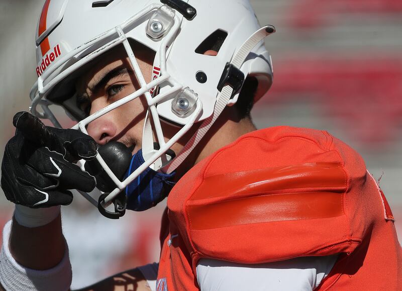 Timpview’s Tei Nacua points to University of Utah head football coach Kyle Whittingham on the sidelines after completing a pass during a 5A football state semifinal game against Olympus at Rice-Eccles Stadium in Salt Lake City on Thursday, Nov. 9, 2023. Timpview won 22-20.