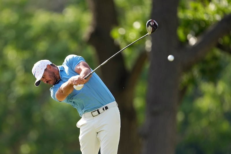 Brooks Koepka hits on the fourth hole during the first round of the U.S. Open golf tournament.