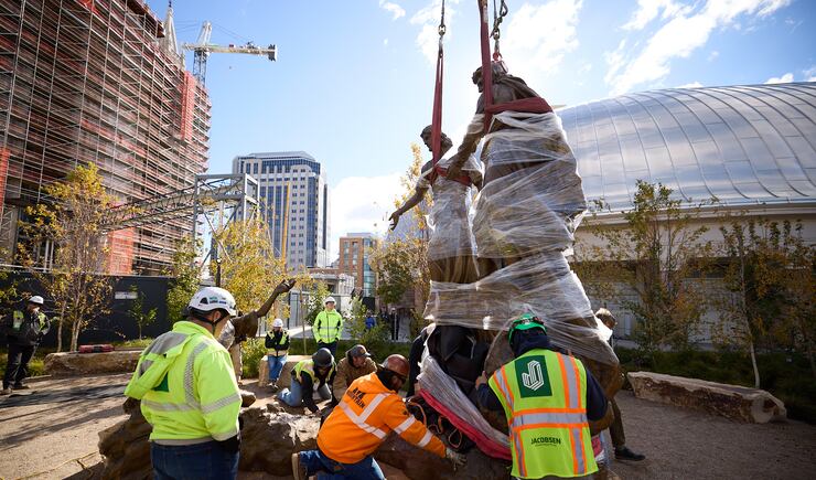 Construction workers place the First Vision statue on Temple Square on Wednesday, Nov. 6, 2024.