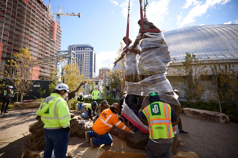Construction workers place the First Vision statue on Temple Square on Wednesday, Nov. 6, 2024.