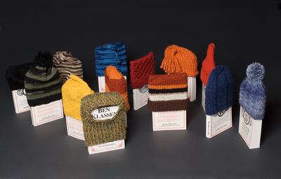 Jane Deshner's installation featuring the 13 books, each with a uniquely knitted hat to cover them.