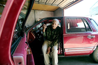 Saxophone player Joe McQueen, still going strong as he nears his 99th birthday. McQueen, who taught auto mechanics at Weber State, shows off his car at his Ogden home on Saturday, May 26, 2018.