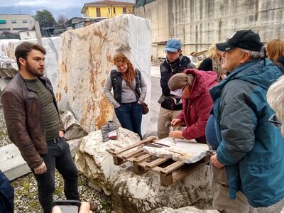 Bronson Evertsen, left, speaks with members of BYU's geology department about the marble sculpting techniques of Michelangelo.