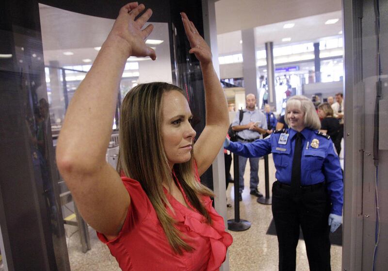 TSA demonstrator Terissa Williams demonstrates the new Automatic Target Recognition software used at the Salt Lake International Airport in Salt Lake City.