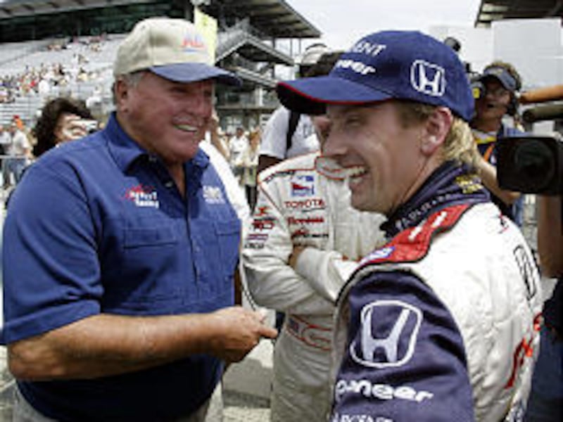 Indy Racing League driver Kenny Brack, right, of Sweden talks with four-time Indy 500 champion A.J. Foyt after qualifying for the 89th Indy 500 with an average speed of 227.598 mph.