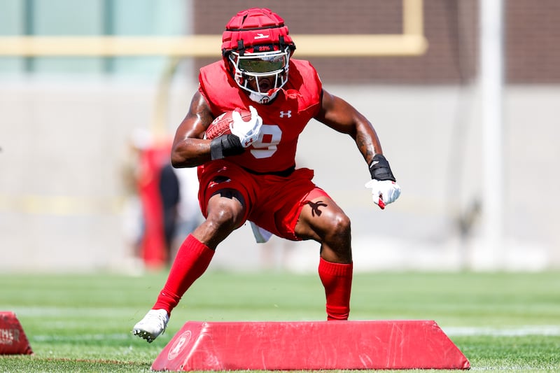 Utah running back Tavion Thomas gets in some work during first day of fall camp at the University of Utah in Salt Lake City.
