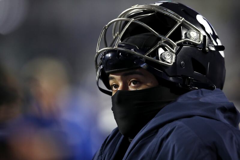 Brigham Young Cougars running back Tyler Allgeier (25) watches from the sideline as BYU falls to UAB.