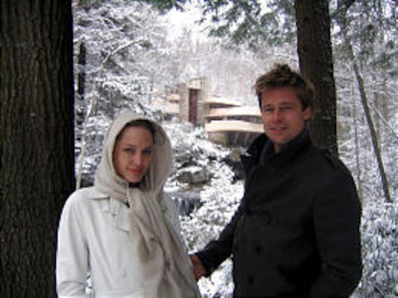 Angelina Jolie and Brad Pitt stand Thursday outside Fallingwater, Frank Lloyd Wright's architectural masterpiece, in Mill Run, Pa.