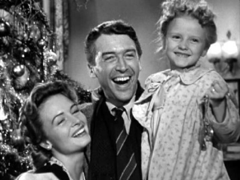 Donna Reed, left, James Stewart and young Karolyn Grimes in the 1946 original, "It's a Wonderful Life."