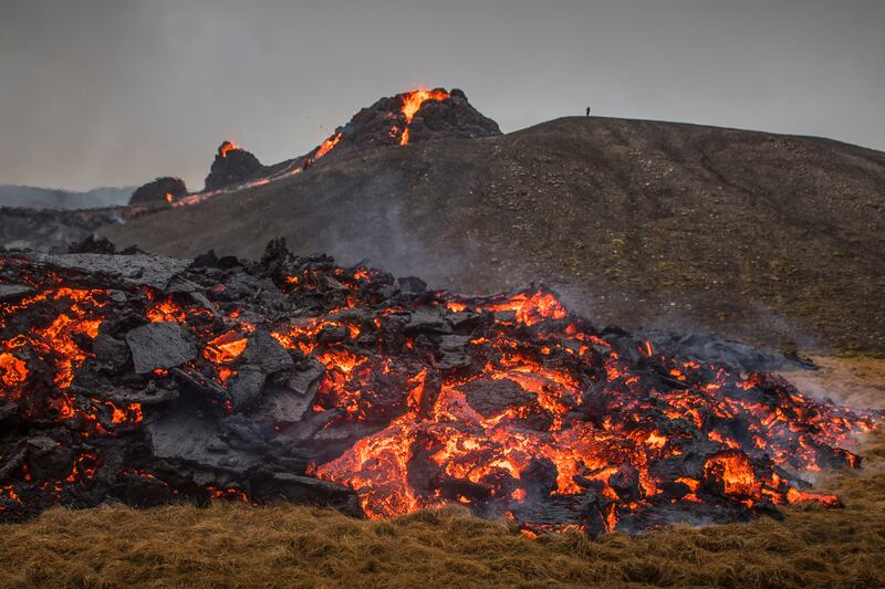 Lava flows from an eruption of a volcano on the Reykjanes Peninsula in southwestern Iceland on Saturday, March 20, 2021.