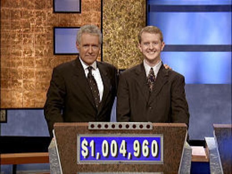 Host Alex Trebek poses with Ken Jennings after the Murray resident’s 30th consecutive win on Tuesday.