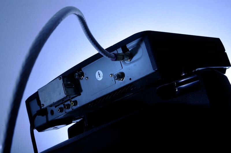 FILE - This Wednesday, May 30, 2007, file photo shows a cable box on top of a television set in Philadelphia. Not that long ago, the clunky cable box looked like it was on its way out. The federal government was pressuring cable companies to open up their