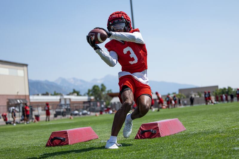 USC transfer Dorian Singer makes a catch during fall camp drills at the University of Utah in Salt Lake City.