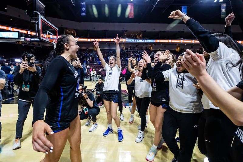 BYU players celebrate the Cougars’ 66-56 win over San Francisco in the West Coast Conference tournament quarterfinals at Orleans Arena in Las Vegas on Saturday, March 4, 2023.