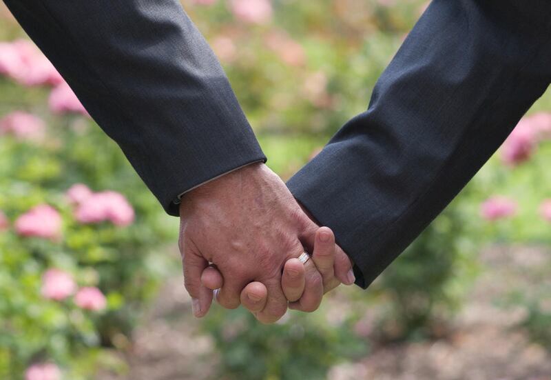 A former instructor at Eagle Gate College is suing the school for allegedly discriminating against his employment and benefits because he is married to another male teacher.
