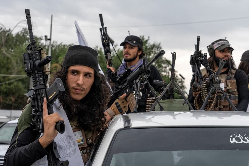 Taliban fighters are pictured celebrating one year since U.S. and coalition forces evacuated Afghanistan.