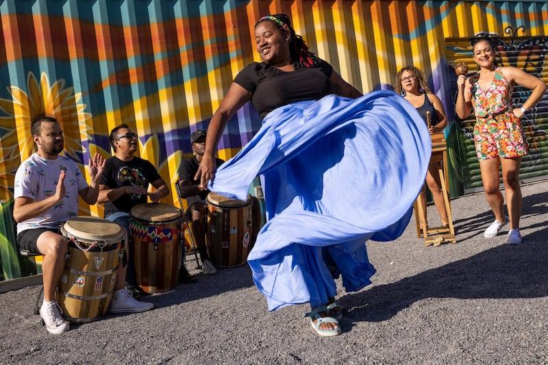 Members of the band Bomba Marilé pose for a photo before a performance at Tracy Aviary’s Jordan River Nature Center.