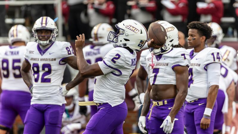 James Madison quarterback Jordan McCloud (2) warms up before the first half of an NCAA college football game against Troy.