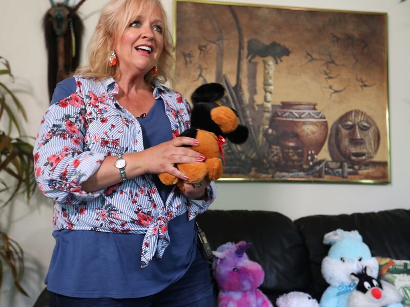 Gun rights activist Janalee Tobias holds a stuffed puppy at her home in South Jordan on Friday, July 13, 2018. Tobias says she was punked by actor Sacha Baron Cohen for his upcoming Showtime series "Who Is America?" Here she re-creates how a stuffed puppy