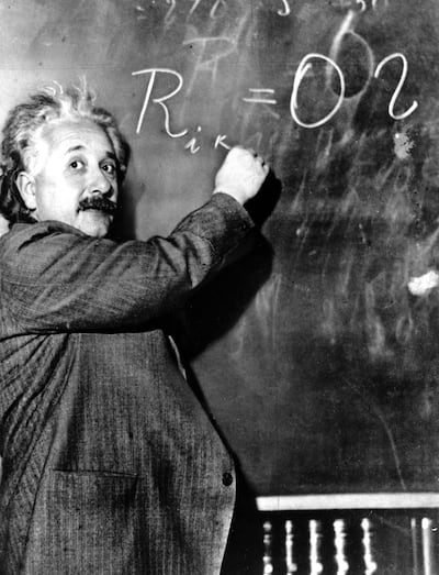 Dr. Albert Einstein writes out an equation for the density of the Milky Way on the blackboard at the Carnegie Institute, Mt. Wilson Observatory headquarters in Pasadena, Calif., on Jan. 14, 1931.